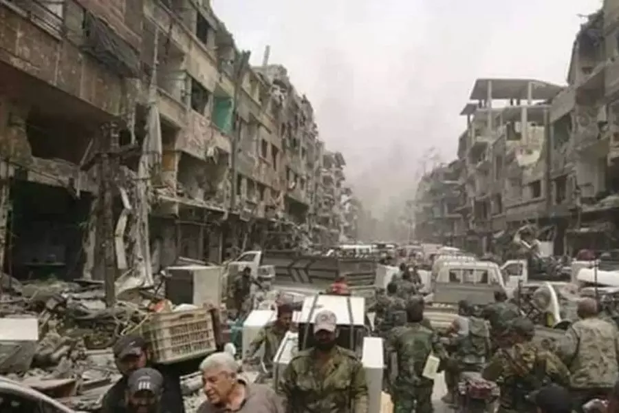 مجموعة العمل: 93.2 % من أهالي مخيم اليرموك تعرضت منازلهم للتعفيش